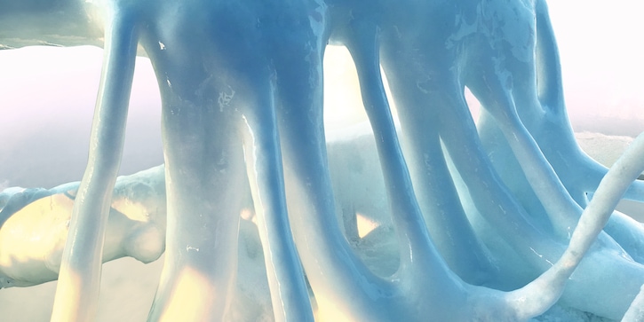 Close up of above ground pipes covered in a thick frost caused by liquid nitrogen.