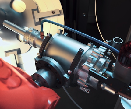 A close-up of the spray nozzle from a cold spraying unit in operation.