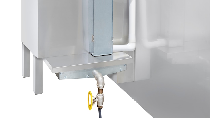 Image showing a modular, self-contained NITROBOOST unit mounted on the wall of a large industrial freezer.