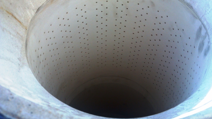 Close up showing the perforated inside of a ceramic oxygen injector used for the gold-recovery process. 